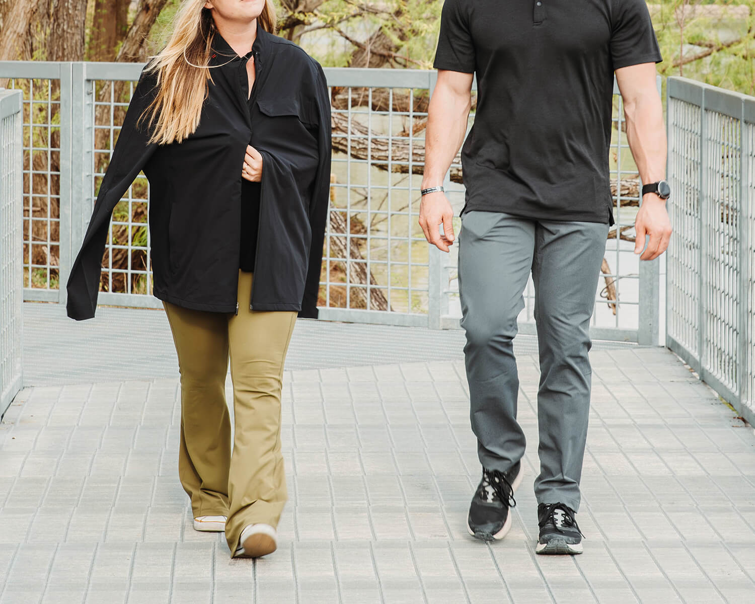 Man and woman on a date wearing Black Crest Technical Khaki Chinos in Grey and Black Technical Polo